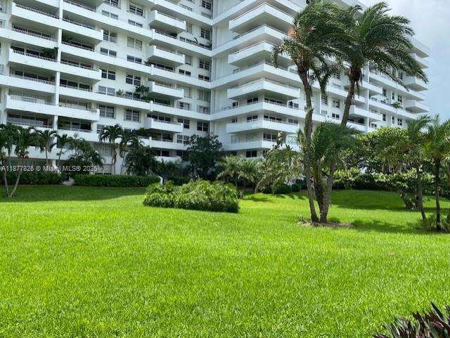 199 Ocean Ln Drive, Unit 707 Key Biscayne, FL 33149 - Photo 22 of 24 a view of building with garden