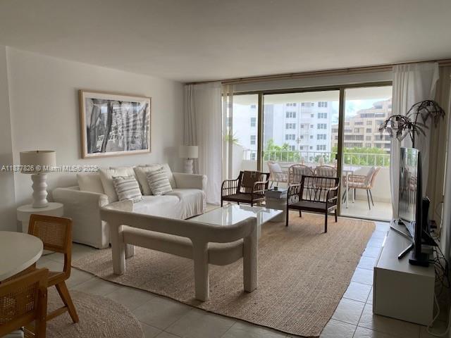 199 Ocean Ln Drive, Unit 707 Key Biscayne, FL 33149 - Photo 5 of 24 a living room with furniture and a floor to ceiling window