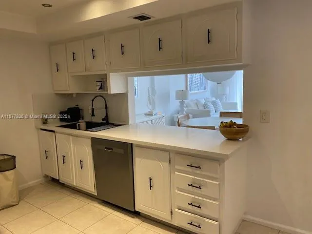 a kitchen with a refrigerator stove and microwave