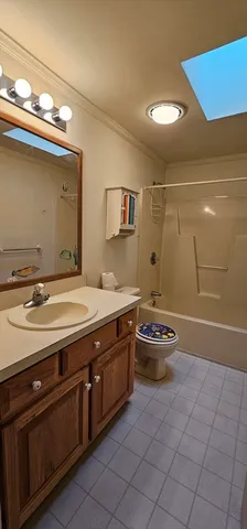 a bathroom with a sink a vanity and a blue