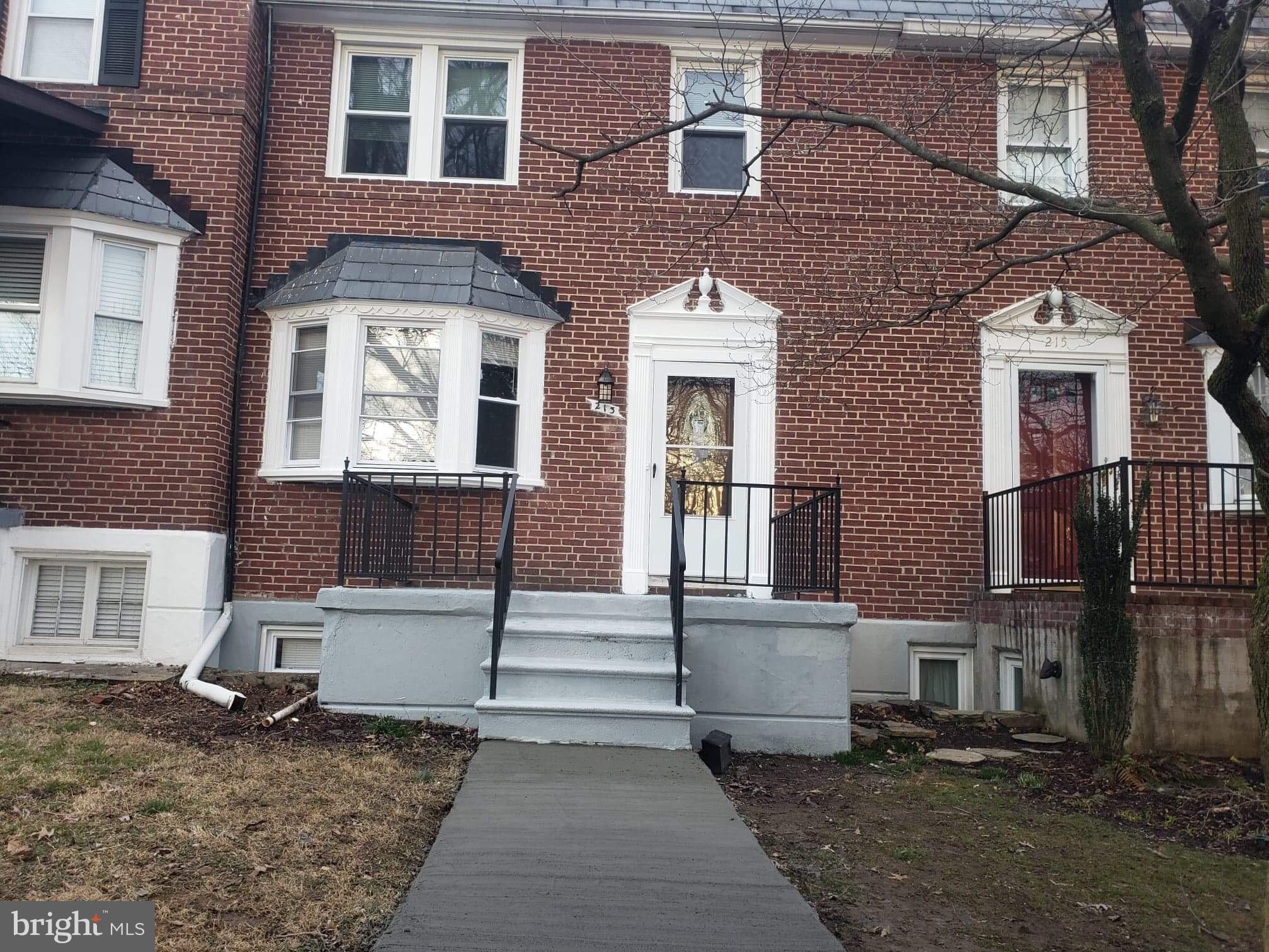 213 Westowne Road Baltimore, MD 21229 - Photo 1 of 20 a front view of a house with stairs