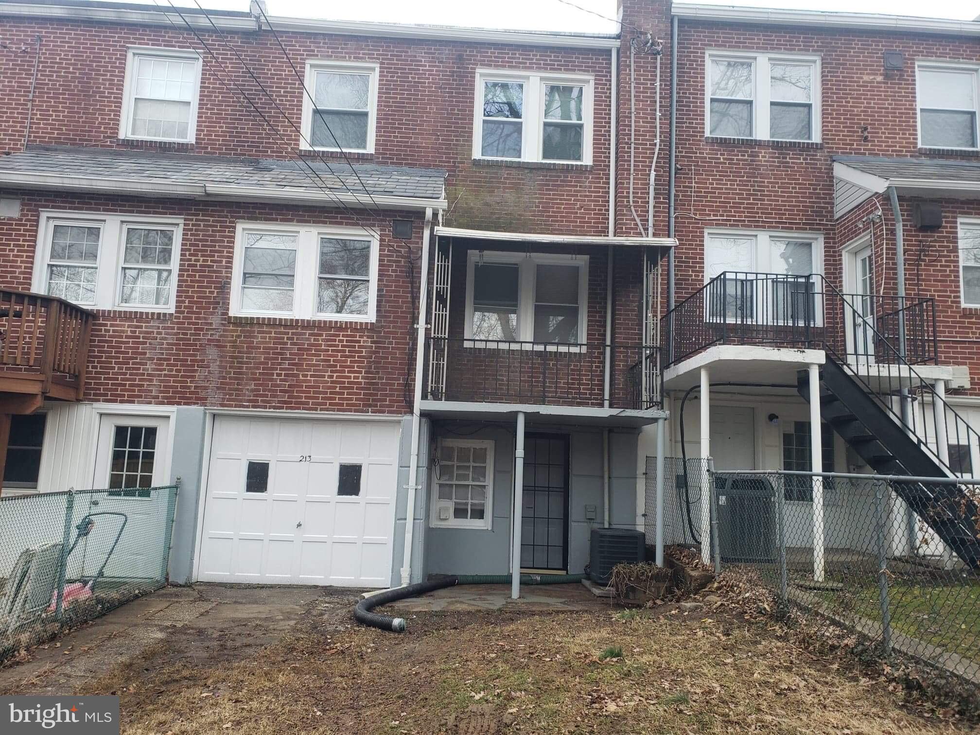 213 Westowne Road Baltimore, MD 21229 - Photo 2 of 20 a view of a white building with large windows