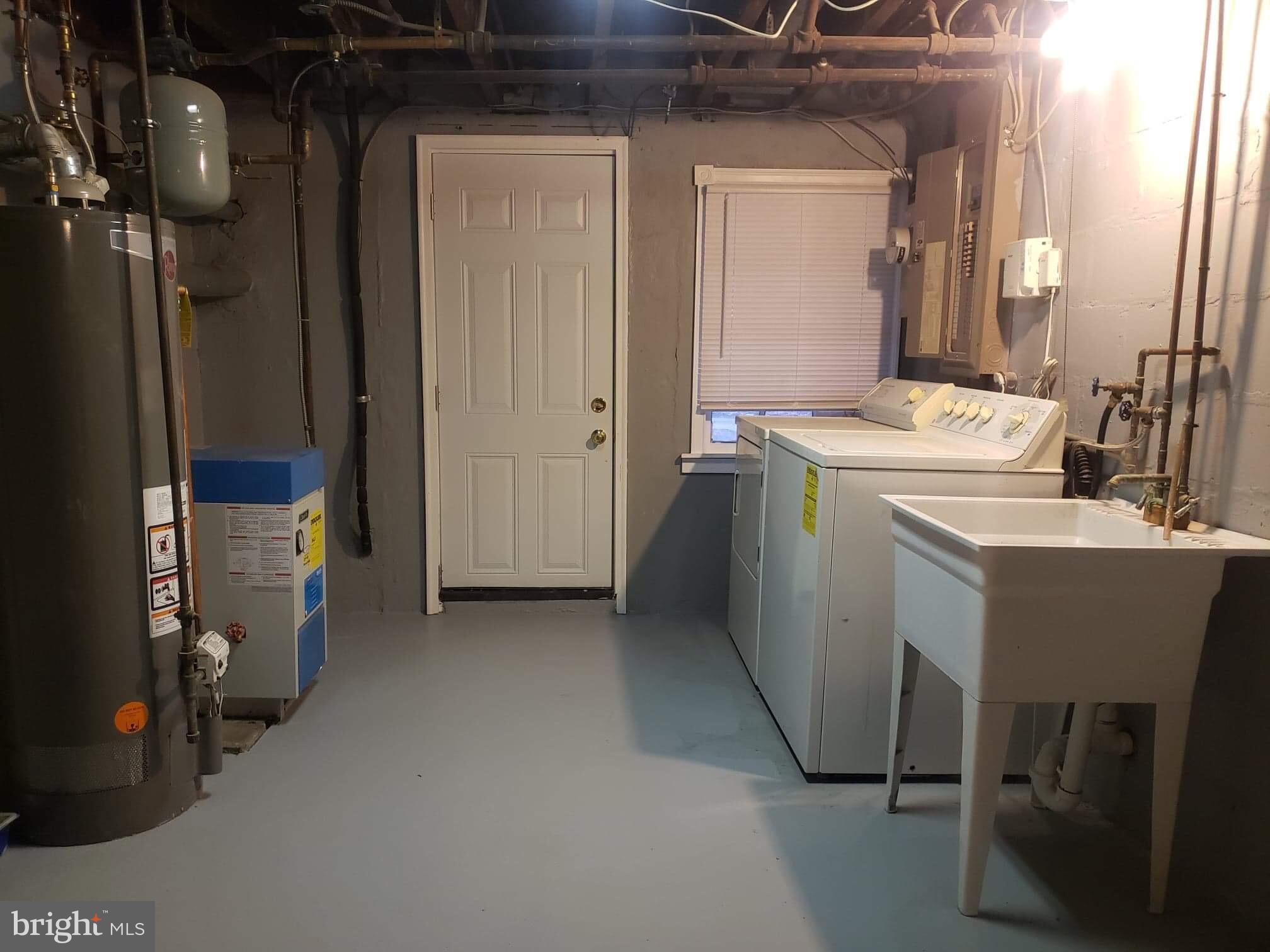 213 Westowne Road Baltimore, MD 21229 - Photo 11 of 20 a utility room with dryer and washer