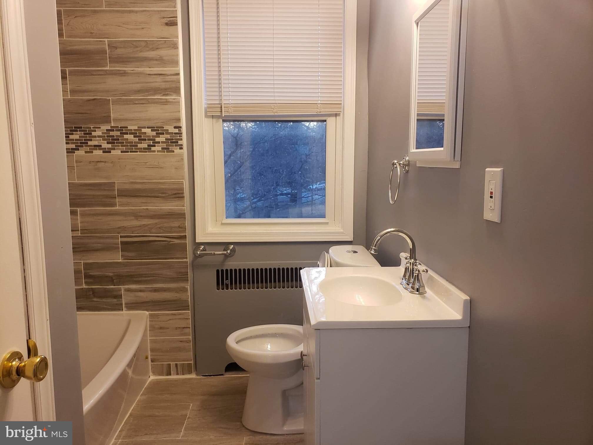 213 Westowne Road Baltimore, MD 21229 - Photo 9 of 20 a bathroom with a toilet sink and shower