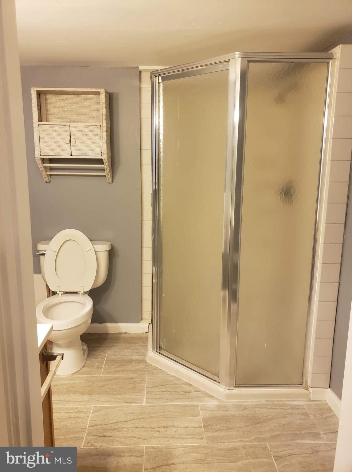213 Westowne Road Baltimore, MD 21229 - Photo 10 of 20 a bathroom with a toilet and a shower