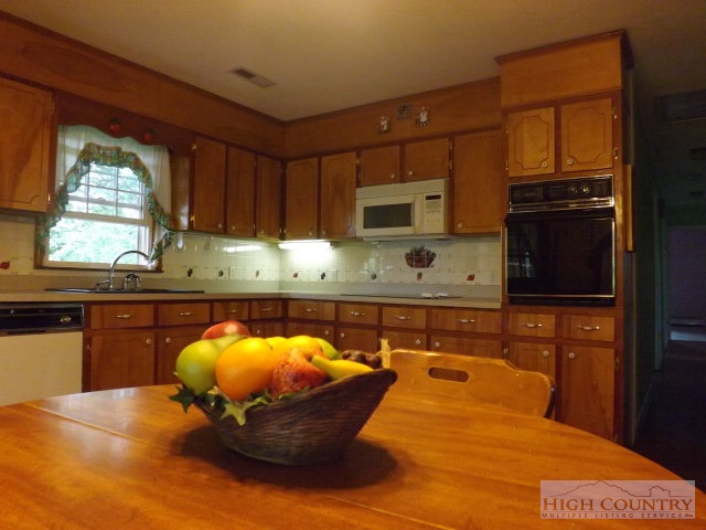 4 Little Pine Road Ennice, NC 28623 - Photo 13 of 13 a room with a large window and kitchen view
