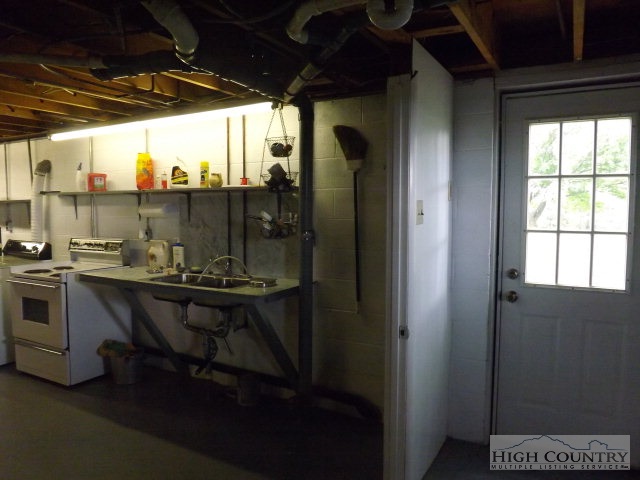 4 Little Pine Road Ennice, NC 28623 - Photo 3 of 13 a bathroom with a sink a mirror and a bathtub