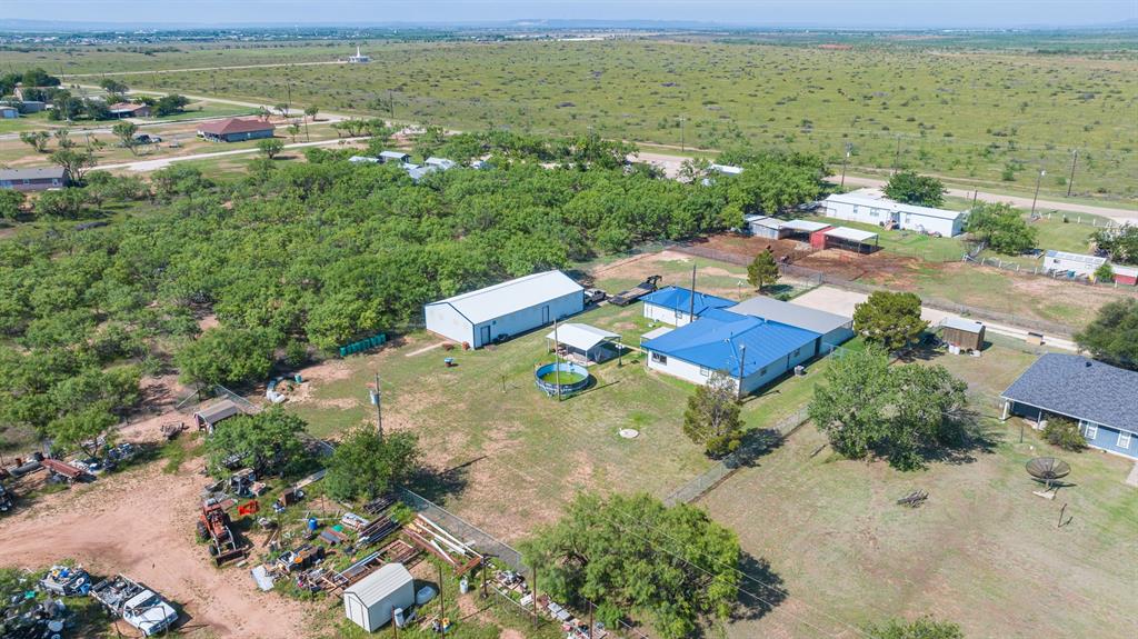 8867 Spinks Road Abilene, TX 79603 - Photo 6 of 9 shop has white roof. house has blue roof.