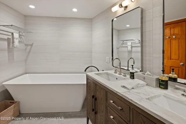 a bathroom with a bathtub and a sink