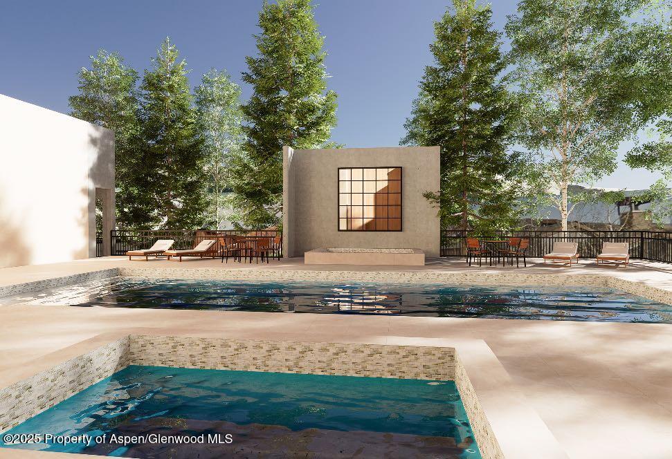 425 Wood Road, Unit 19 Snowmass Village, CO 81615 - Photo 19 of 26 a front view of a house with a yard