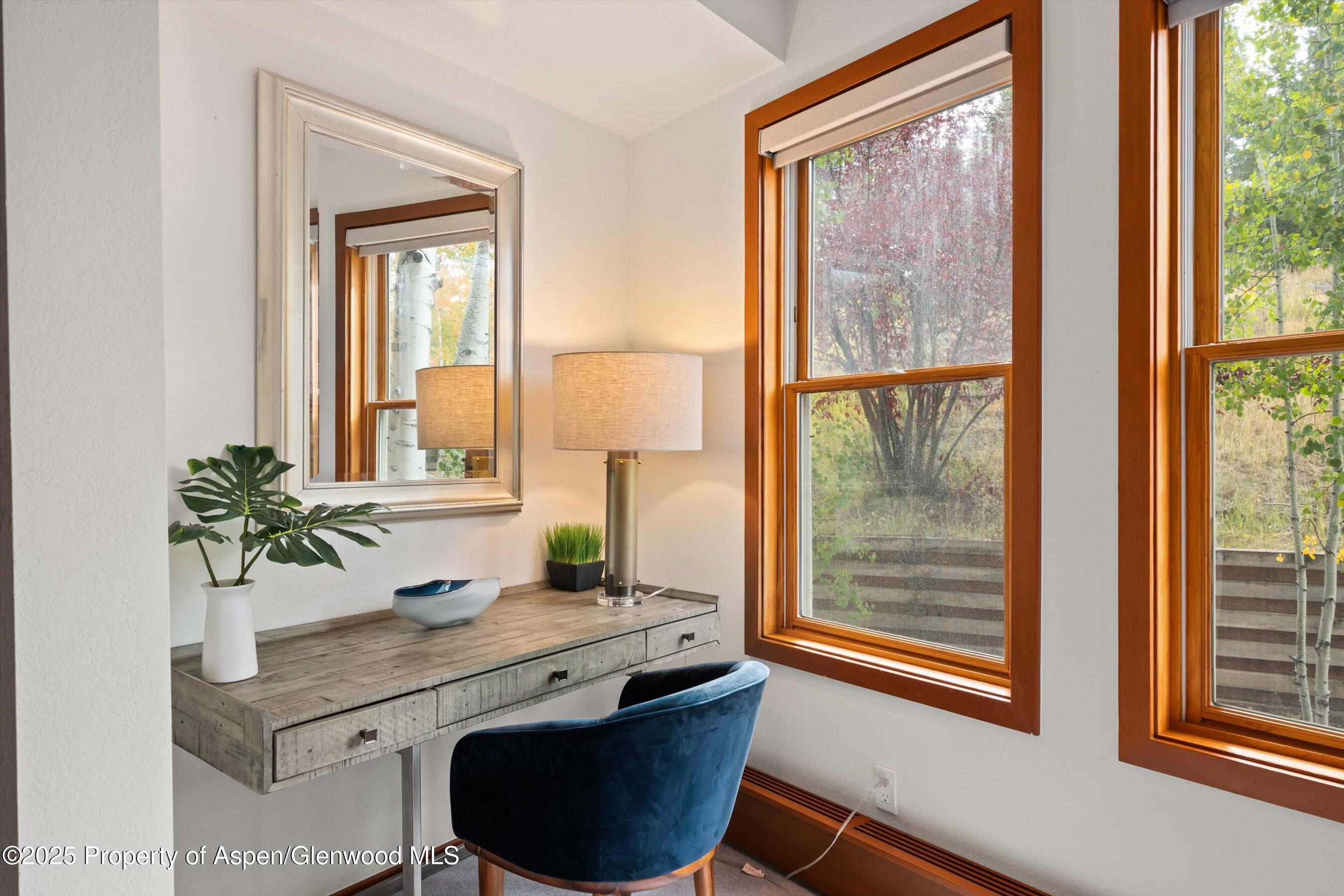 425 Wood Road, Unit 19 Snowmass Village, CO 81615 - Photo 6 of 26 a bathroom with a granite countertop sink toilet and large mirror