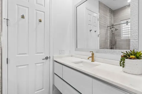 a bathroom with a sink and a mirror