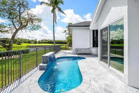 a view of a swimming pool with a lounge chair