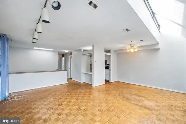 a view of a livingroom with a chandelier fan