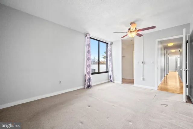 a bathroom with a sink toilet vanity and shower