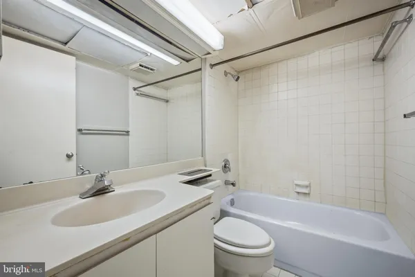 a view of a house with a large tree