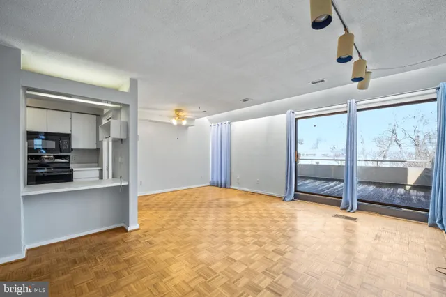 a view of an empty room with a window