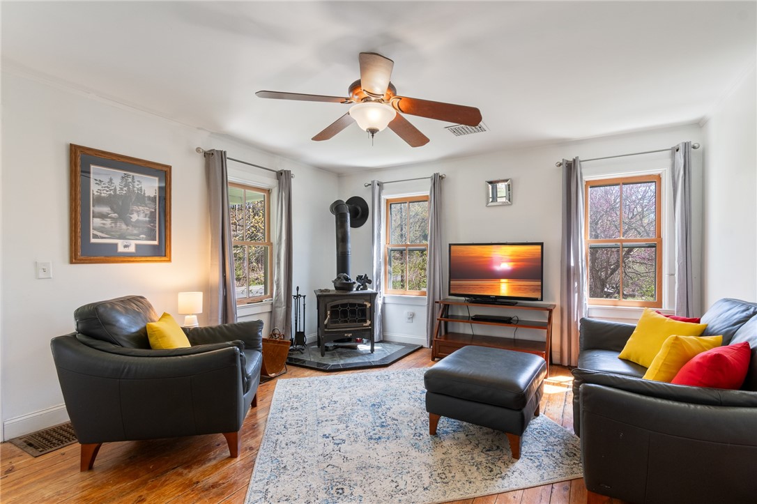 4427 Boynton Road Walworth, NY 14568 - Photo 36 of 49 The living room - with a wood burning stove - keep