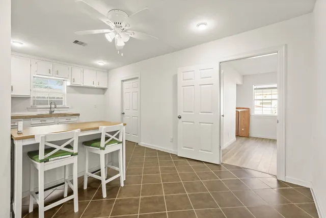 a view of a kitchen with a sink and cabinet