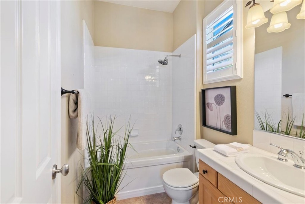 1486 Valley Drive Norco, CA 92860 - Photo 12 of 66 a bathroom with a sink a toilet and a bathtub