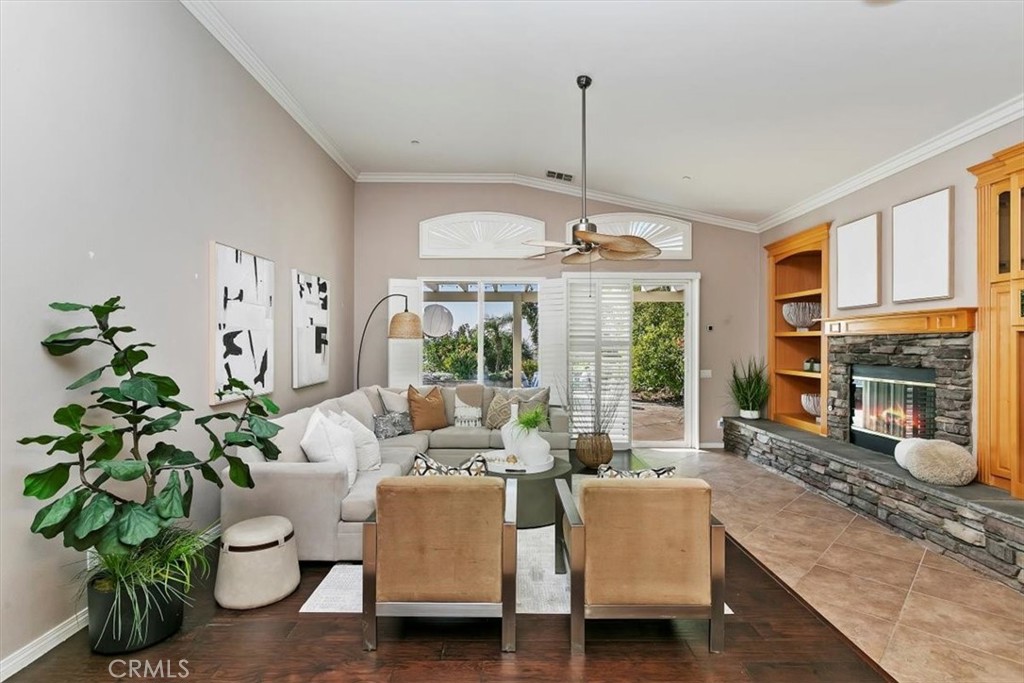 1486 Valley Drive Norco, CA 92860 - Photo 20 of 66 a living room with furniture chandelier and a fireplace