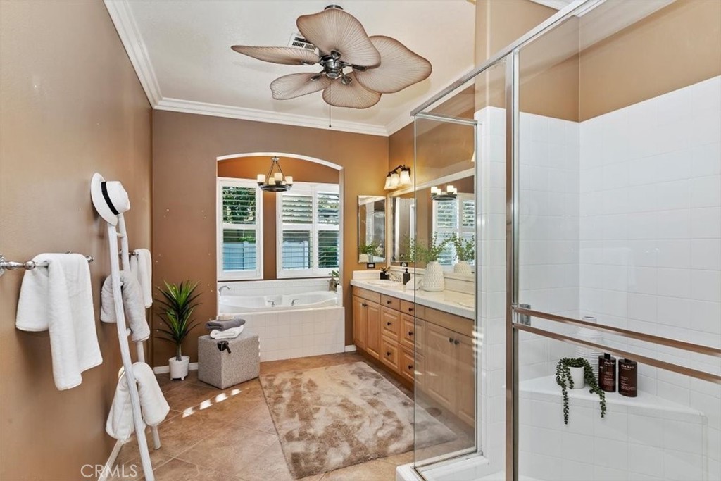 1486 Valley Drive Norco, CA 92860 - Photo 31 of 66 a large bathroom with a tub sink and mirror