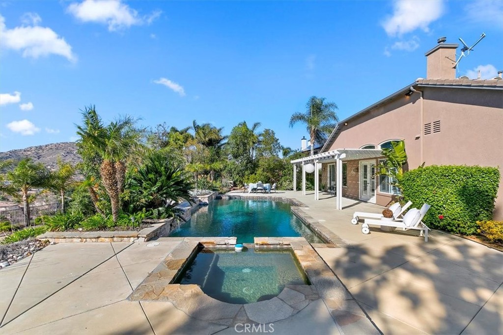 1486 Valley Drive Norco, CA 92860 - Photo 34 of 66 a view of a house with backyard and sitting area