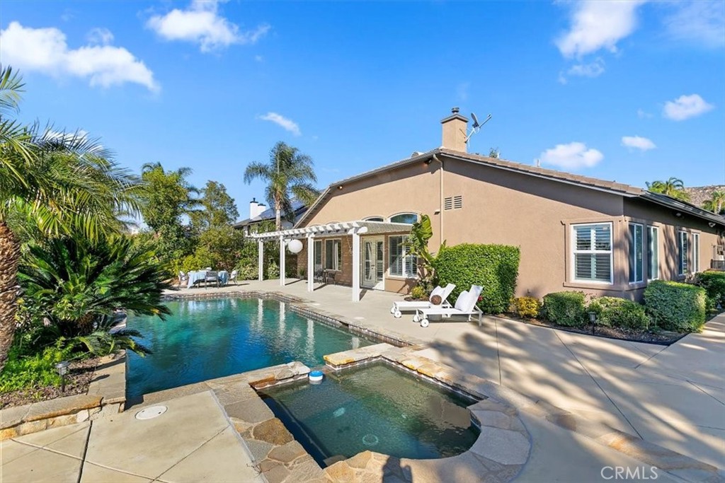 1486 Valley Drive Norco, CA 92860 - Photo 40 of 66 a view of a house with pool and sitting area