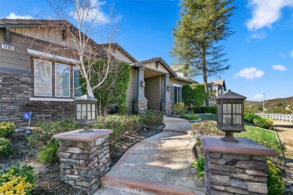 1486 Valley Drive Norco, CA 92860 - Photo 7 of 66 a front view of a house with garden