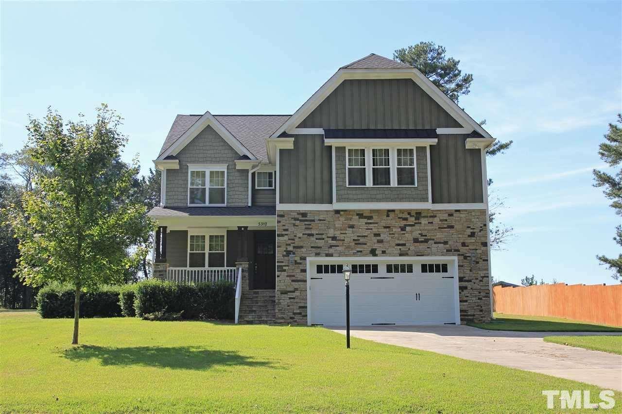 5312 Olive Road Raleigh, NC 27606 - Photo 1 of 5 a front view of a house with a yard