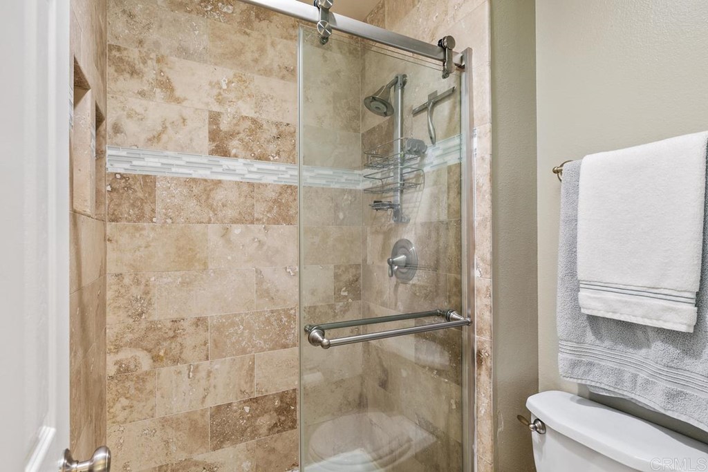 1005 Woodcreek Road Fallbrook, CA 92028 - Photo 19 of 32 a bathroom with a shower