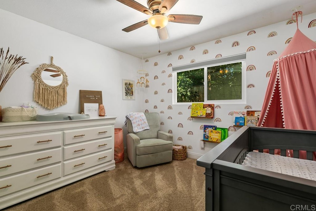 1005 Woodcreek Road Fallbrook, CA 92028 - Photo 22 of 32 a living room with furniture and a flat screen tv