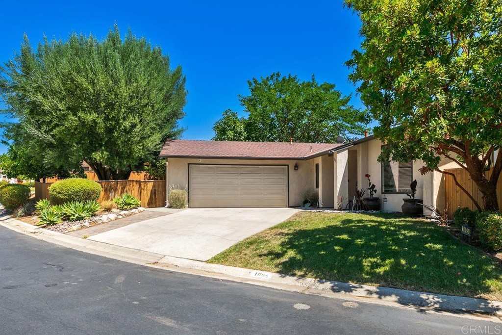 1005 Woodcreek Road Fallbrook, CA 92028 - Photo 3 of 32 front view of a house with a street