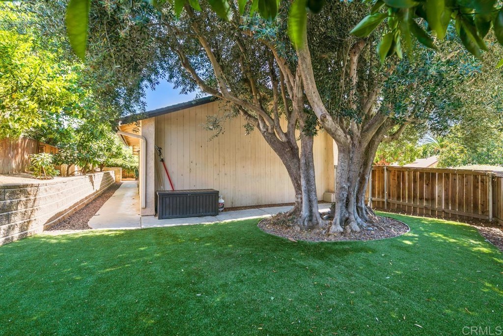 1005 Woodcreek Road Fallbrook, CA 92028 - Photo 31 of 32 a view of a chair and table in the yard