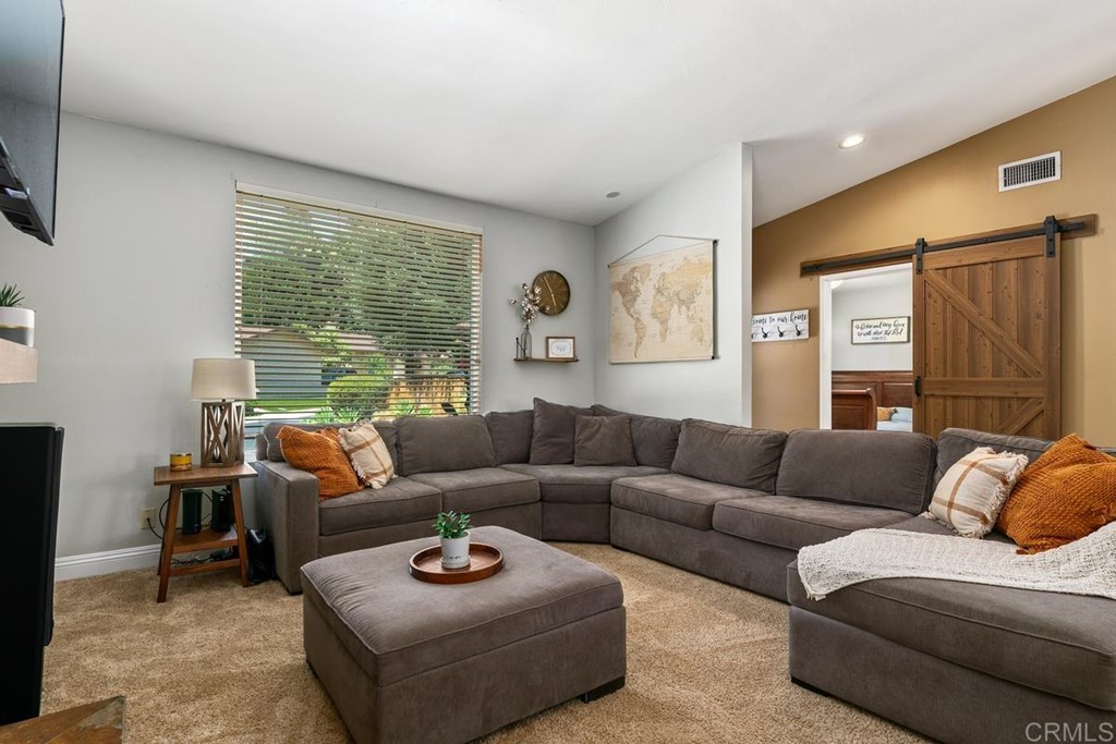 1005 Woodcreek Road Fallbrook, CA 92028 - Photo 9 of 32 a living room with furniture and a large window