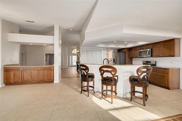 a group of chairs sitting in kitchen and dining room