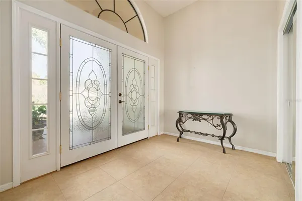 a view of a room with painting on the wall