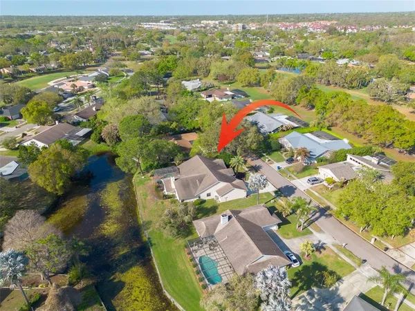 an aerial view of residential houses with outdoor space