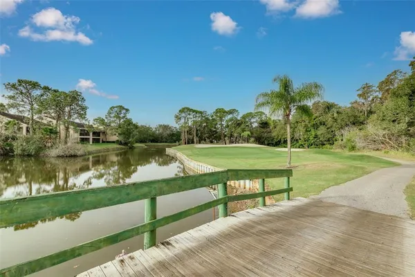 a view of a lake with a yard