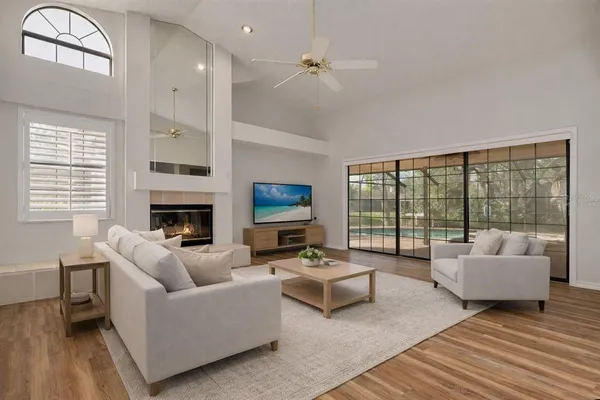 a living room with furniture and a fireplace