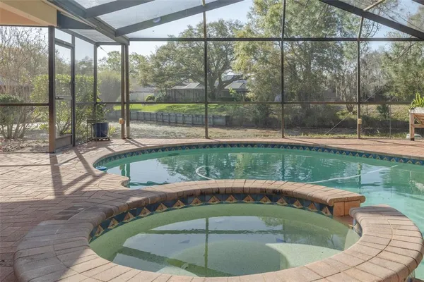 a view of a swimming pool with a sitting area