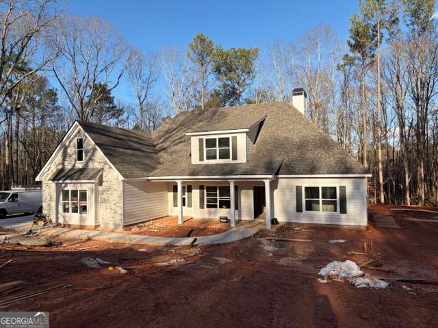 926 Liberty Church Road Carrollton, GA 30116 - Photo 2 of 3 front view of a house with a yard