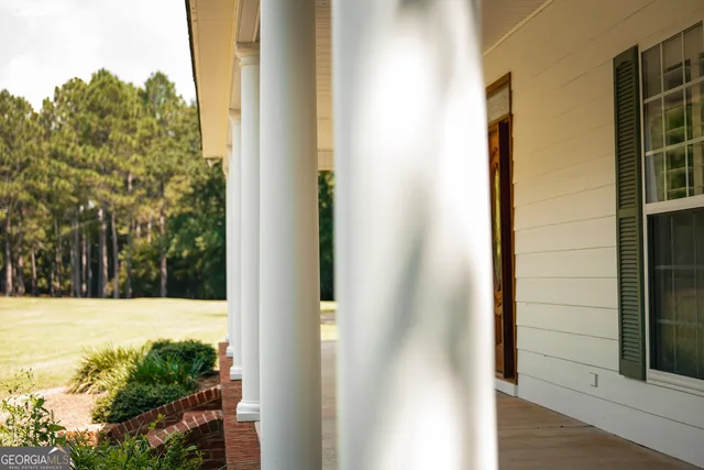 a view of a backyard of the house