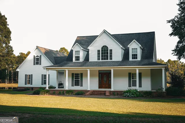 a view of lake with large trees