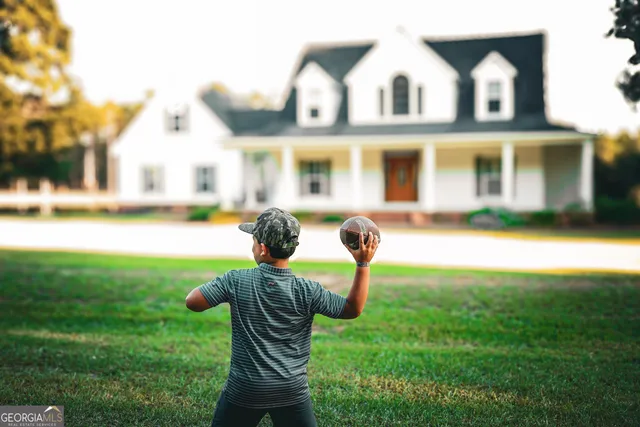 a front view of house with yard and seating area