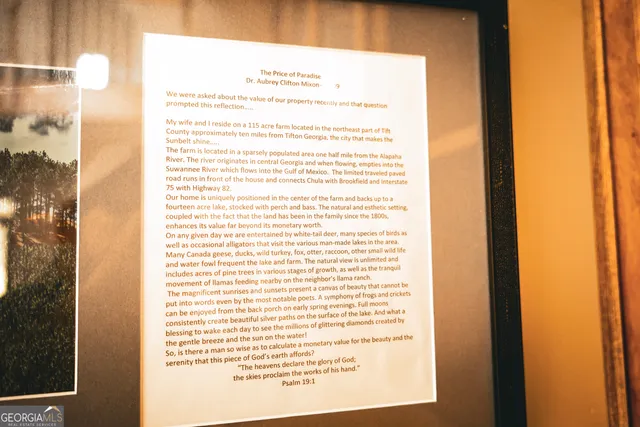 a backyard of a house with lots of plants and trees