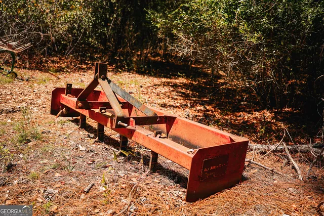 a front view of house with yard and lake