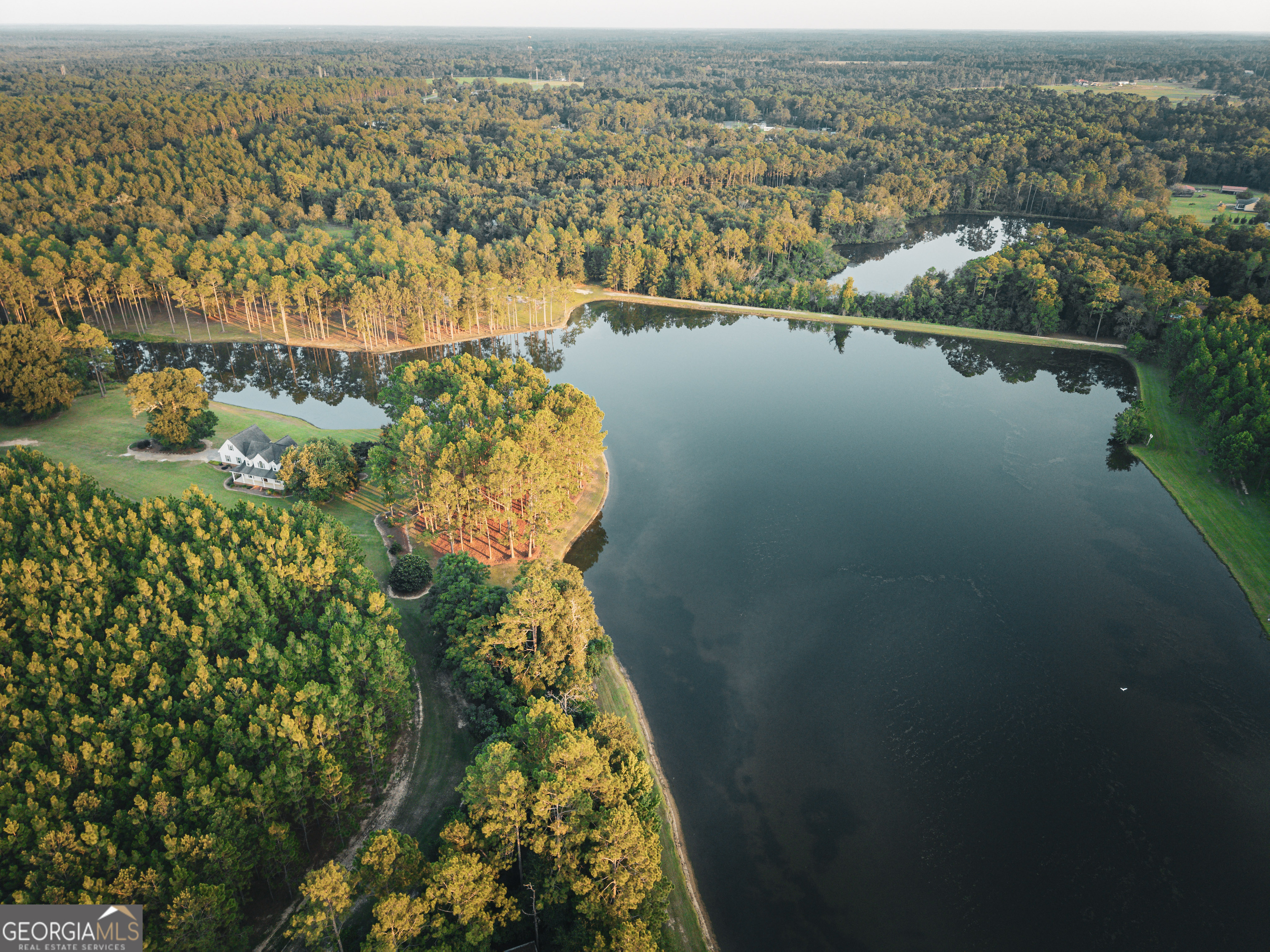 1576 Chula Brookfield Road Tifton, GA 31794 - Photo 63 of 79 an aerial view of lake and residential houses with outdoor space