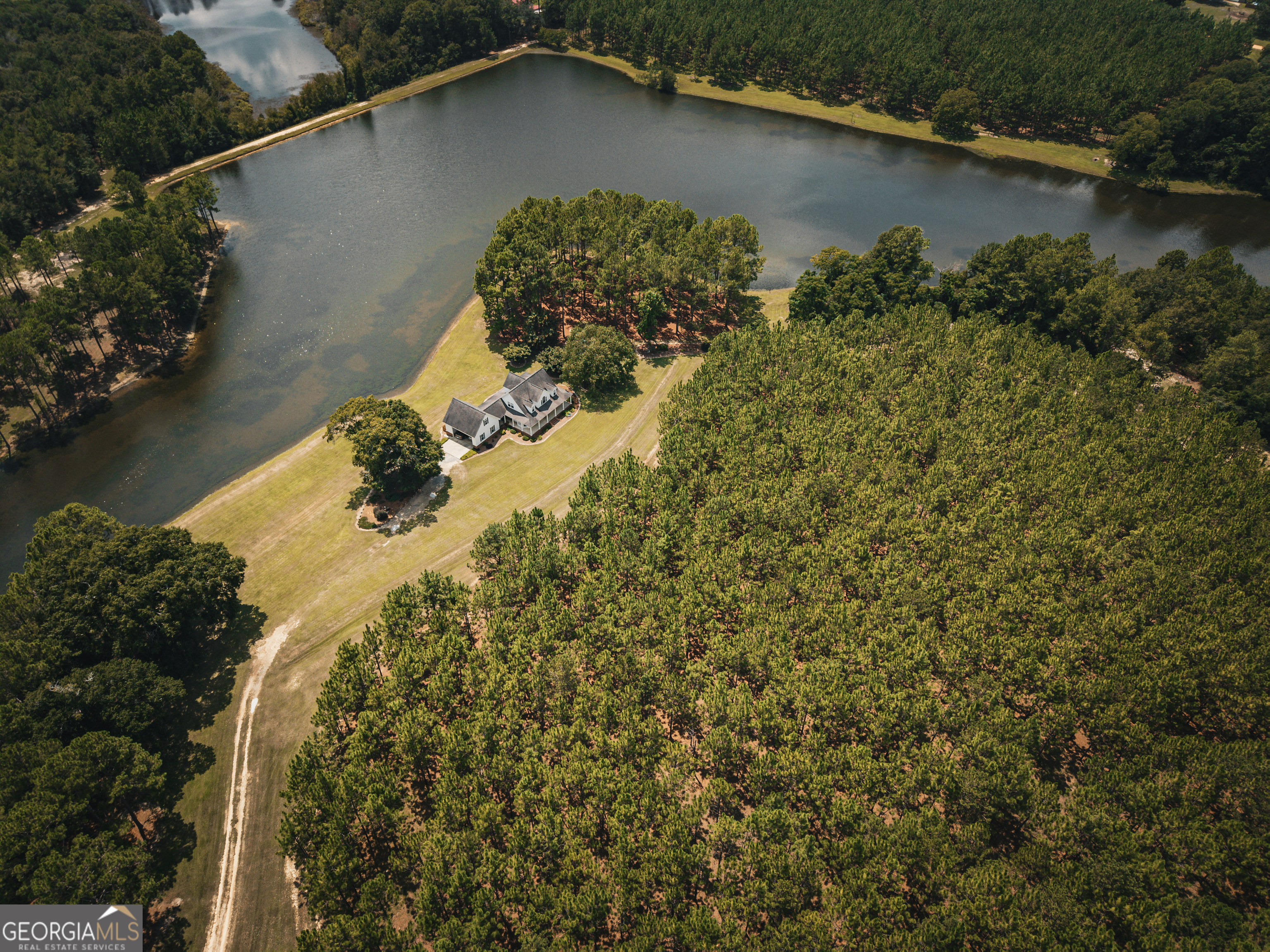 1576 Chula Brookfield Road Tifton, GA 31794 - Photo 64 of 79 an aerial view of a house with a yard and lake view