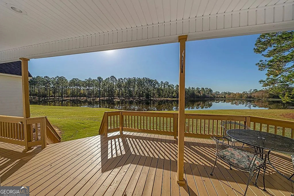 1576 Chula Brookfield Road Tifton, GA 31794 - Photo 72 of 79 a view of a balcony with lake view and wooden floor